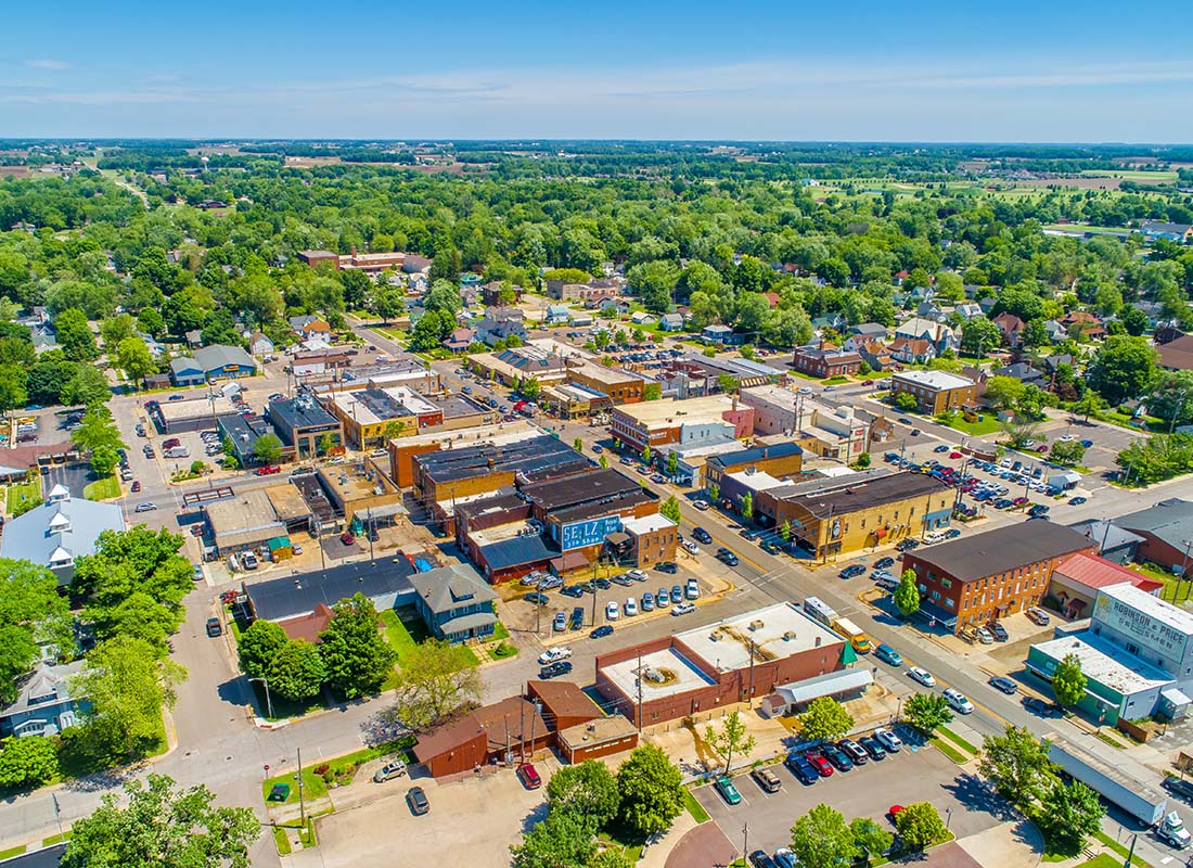 Jewell, IA - Aerial View of Downtown Jewell Iowa Buildings Surrounded by Green Foliage on a Sunny Summer Day