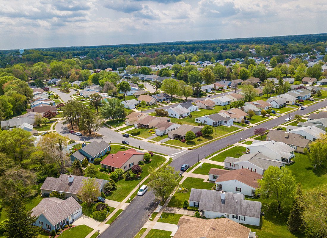 Monroe, IA - Aerial View of a Quiet Residential Community with Homes in the Small Town of Monroe Iowa on a Summer Day